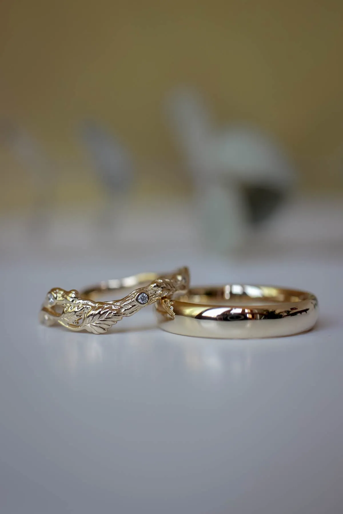 Wedding rings set for couples: classic band for him, branch band with diamonds for her