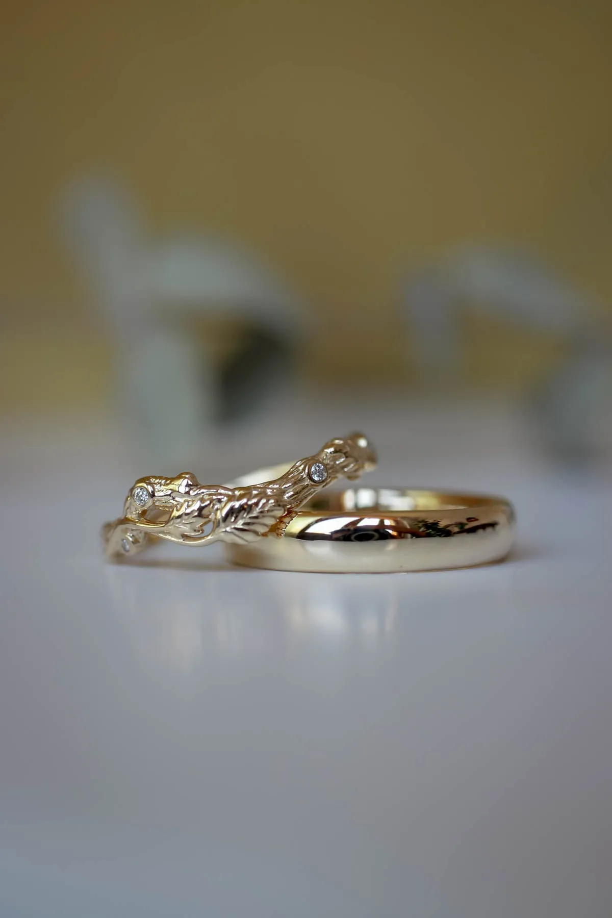 Wedding rings set for couples: classic band for him, branch band with diamonds for her