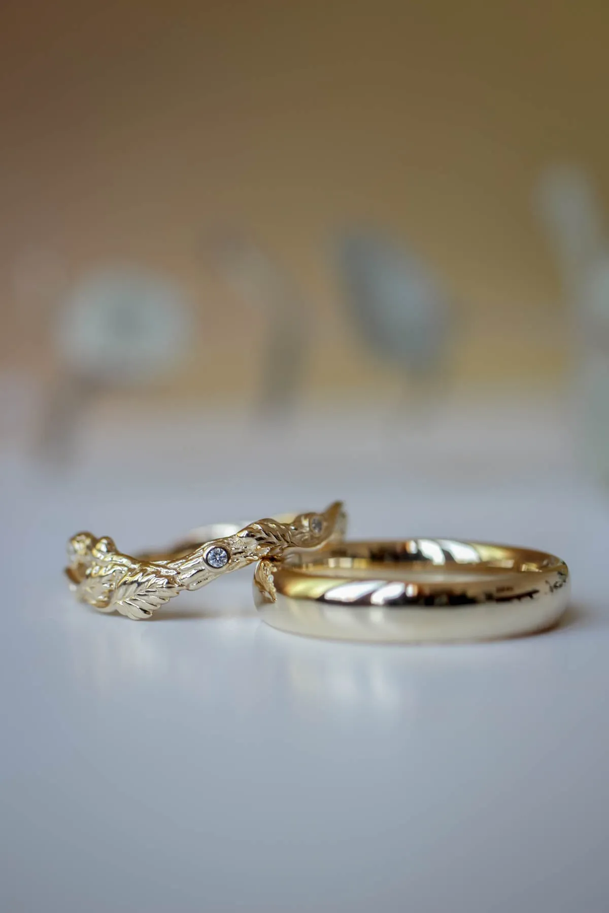 Wedding rings set for couples: classic band for him, branch band with diamonds for her