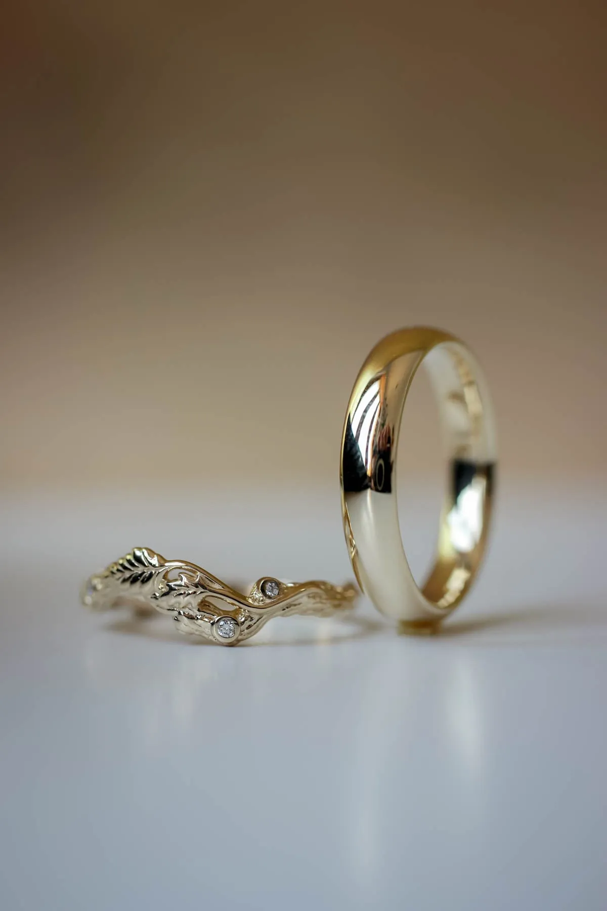 Wedding rings set for couples: classic band for him, branch band with diamonds for her