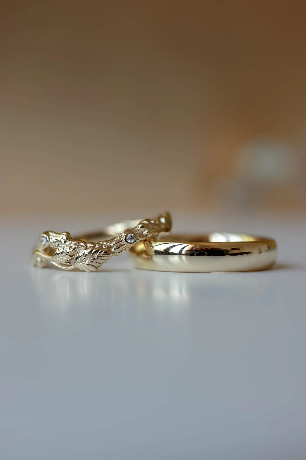 Wedding rings set for couples: classic band for him, branch band with diamonds for her
